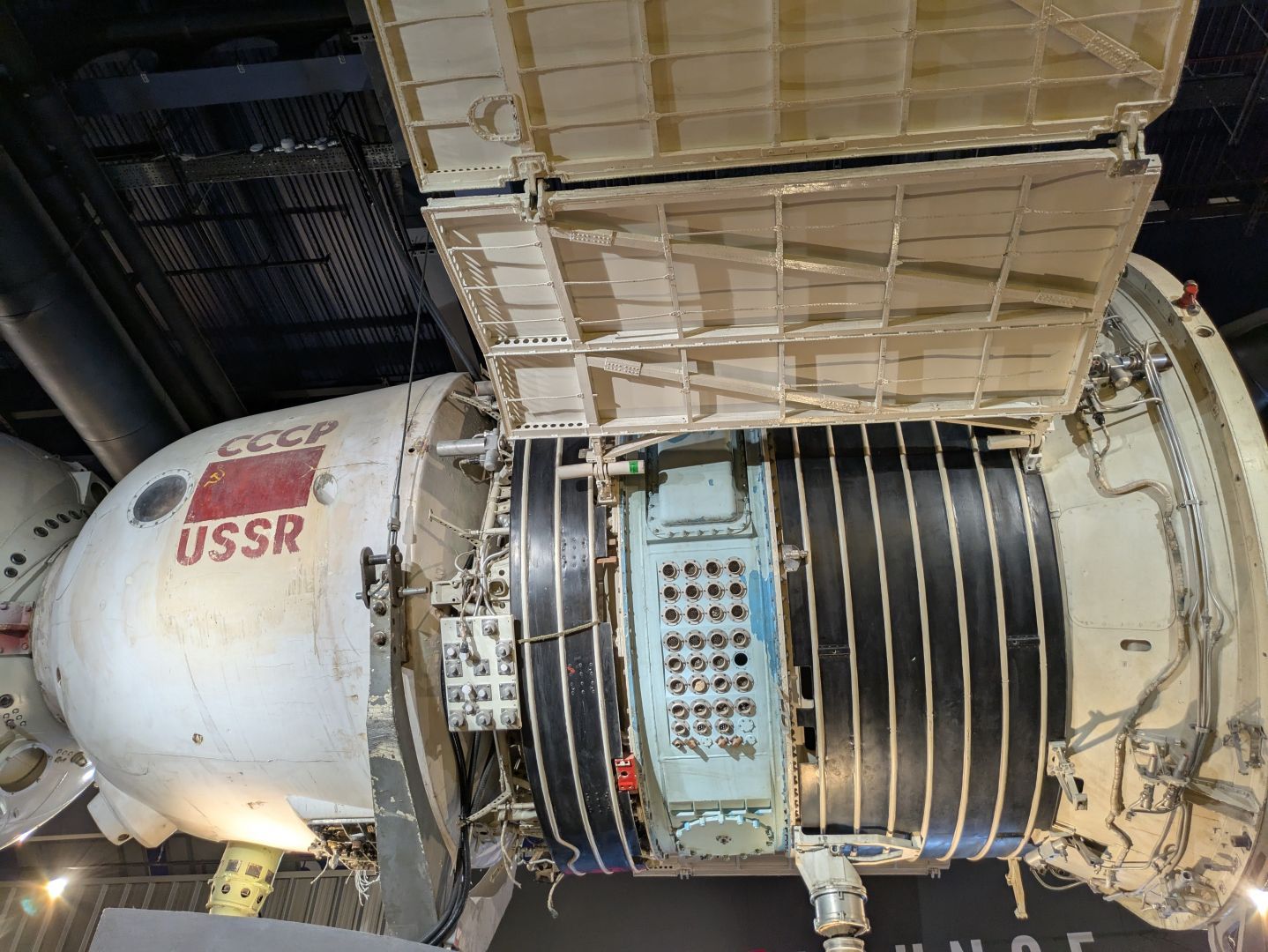 A photo of a satellite, showing a lot of different ports on it